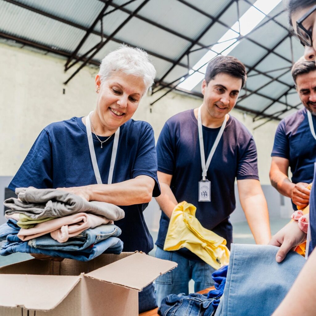 Volunteers organizing donation boxes at community center